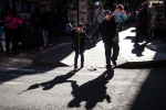 Father and children, Roosevelt Avenue, Jackson Heights, 2019.