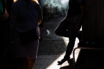 Smoking, Roosevelt Ave and 82nd St., Queens, NY. 2019